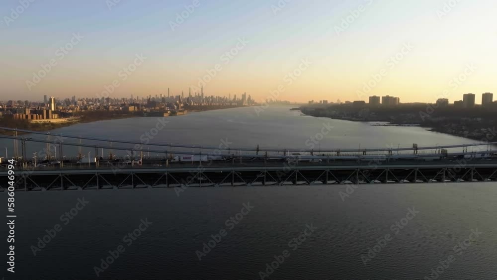 Traffic on the GW bridge with the Manhattan skyline in the background - Aerial view Traffic on the GW bridge with the Manhattan skyline in the background - Aerial view