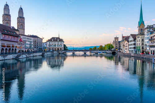 Sunrise view of historic city center of Zuerich with famous Fraumuenster and Grossmuenster Churches and river Limmat ,Switzerland
