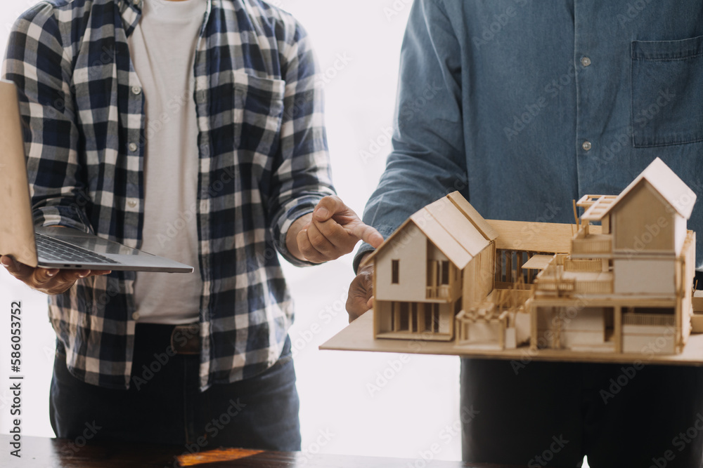 Image of engineering objects on workplace with three partners interacting on background Image of engineering objects on workplace with three partners interacting on background