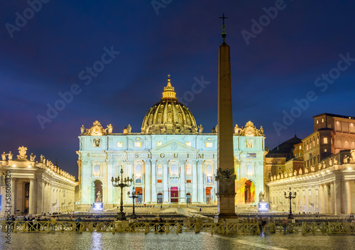 St. Peter's basilica in Vatican at night, center of Rome, Italy (translation "Follow me")