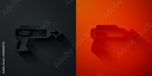 Paper cut Fishing harpoon icon isolated on black and red background. Fishery manufacturers for catching fish under water. Diving underwater equipment. Paper art style. Vector