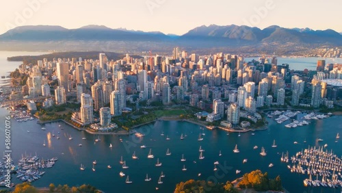 Vancouver downtown skyline aerial flythrough, BC, Canada at sunset