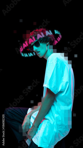 Young boy with neon lettering around head posing isolated over black background in neon light