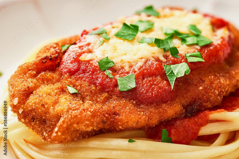 Close up Chicken Parmesan low angle view. Macro shot with focus stacking Close up Chicken Parmesan low angle view. Macro shot with focus stacking