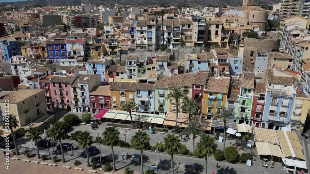 Aerial drone view of La Vila Joiosa.Flying over colorful houses on the Mediterranean coast in the city of La Vila Joiosa in Spain.Costa Blanca. Aerial drone view of La Vila Joiosa.Flying over colorful houses on the Mediterranean coast in the city of La Vila Joiosa in Spain.Costa Blanca.