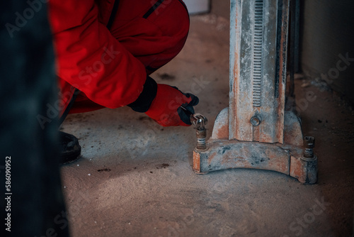 Man setting up a concrete core driller