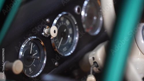 Taro in historic car in dashboard with white steering wheel in wordergrund from old car