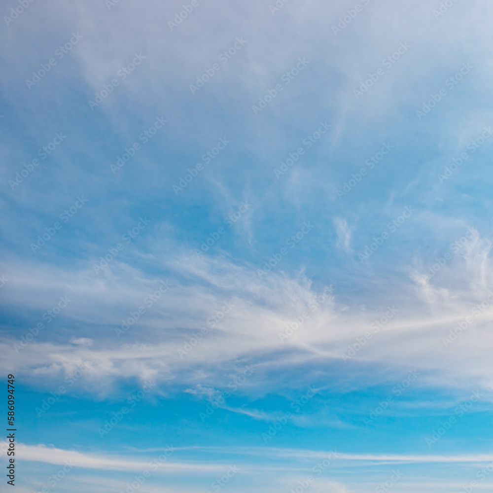Obraz premium Beautiful white fluffy clouds on bright blue sky.