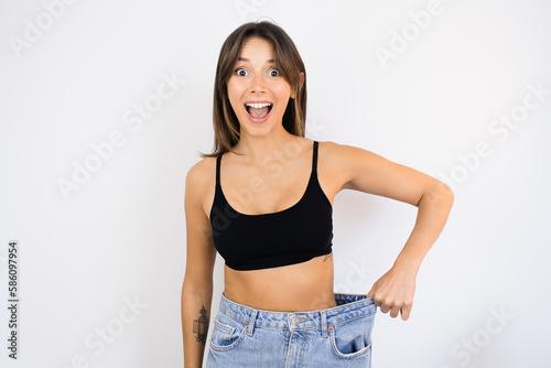 Happy Woman Weight Loss Wearing Old Pair of Jeans Too Big Thin Waist Slim Female Body