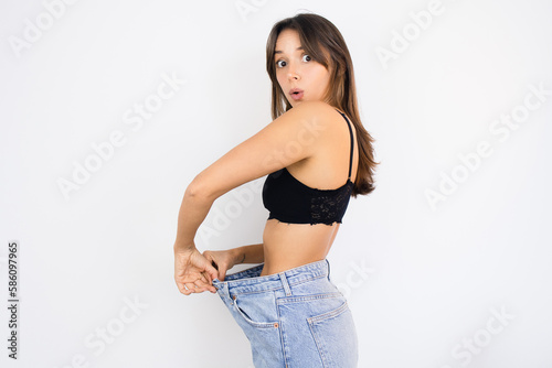 Happy Woman Weight Loss Wearing Old Pair of Jeans Too Big Thin Waist Slim Female Body