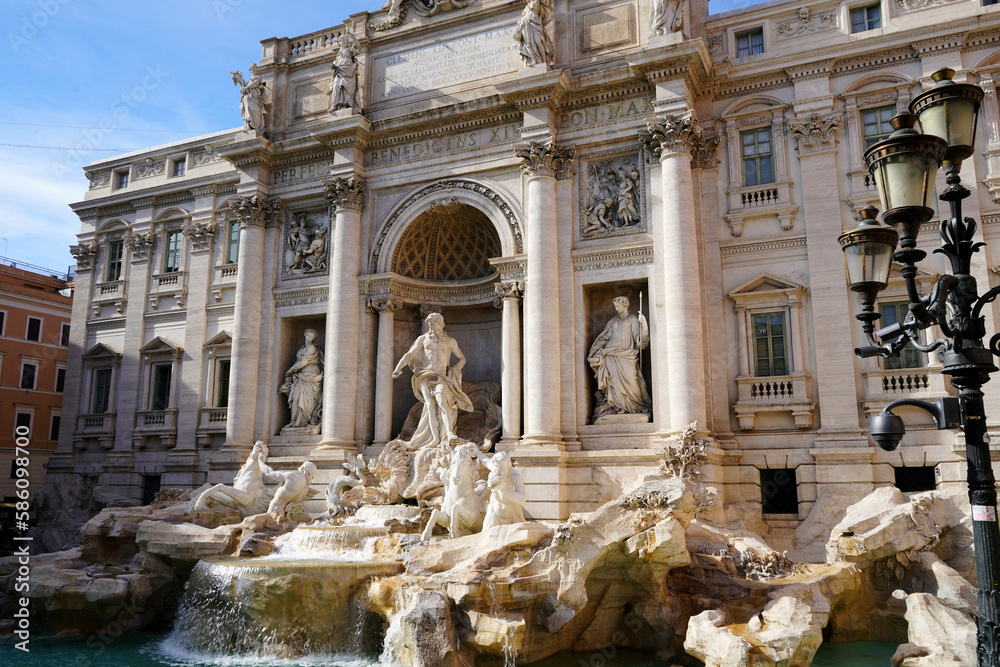 Trevi Fountain in Rome, Italy, lit by the afternoon sun.