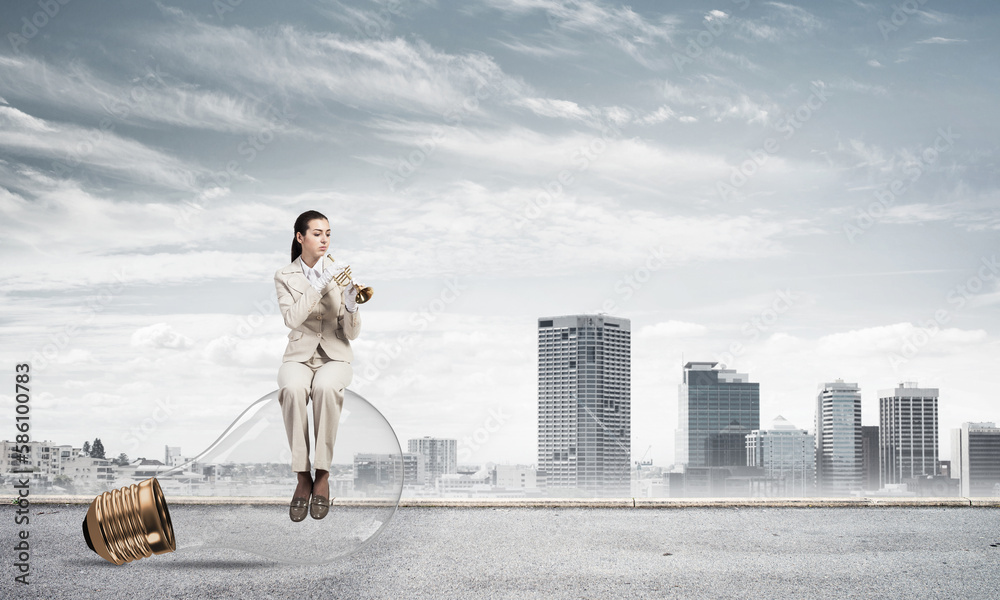 Attractive woman playing trumpet brass Attractive woman playing trumpet brass
