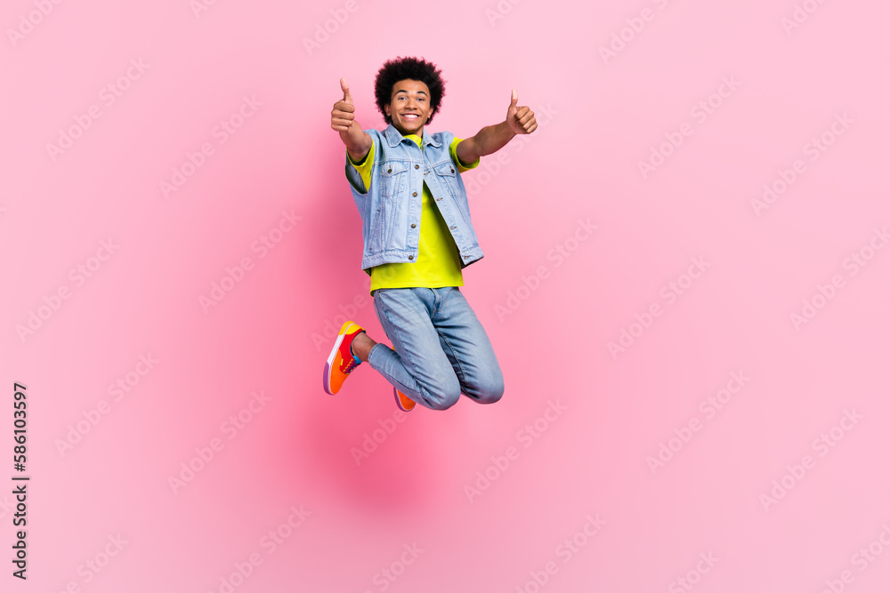 Full length photo of cheerful positive man wear stylish clothes celebrate discounts sale empty space isolated on pink color background