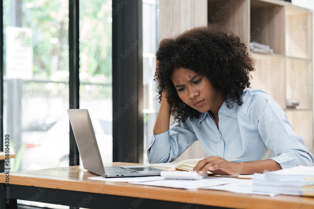 Bored workaholic accountant employee with headache and stress. Black woman overwork at office Bored workaholic accountant employee with headache and stress. Black woman overwork at office