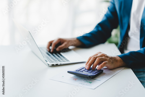 Close-up of business people working on taxes  financial accounting calculations  brokerage  copy space