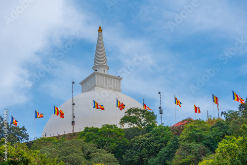 Sunset view of Maha stupa at Mihintale buddhist site in Sri Lanka photo