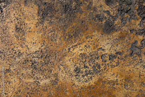 A brown and tan surface with a rough texture.