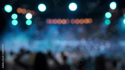 People dancing in Club. Background blurred lights.