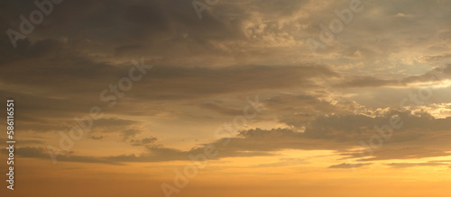 Panoramic view of sky at sunset with lots of clouds and golden light. Clear sky. © Photo Sesaon