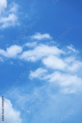 White Fluffy Clouds Flowing on Vibrant Blue Sky 