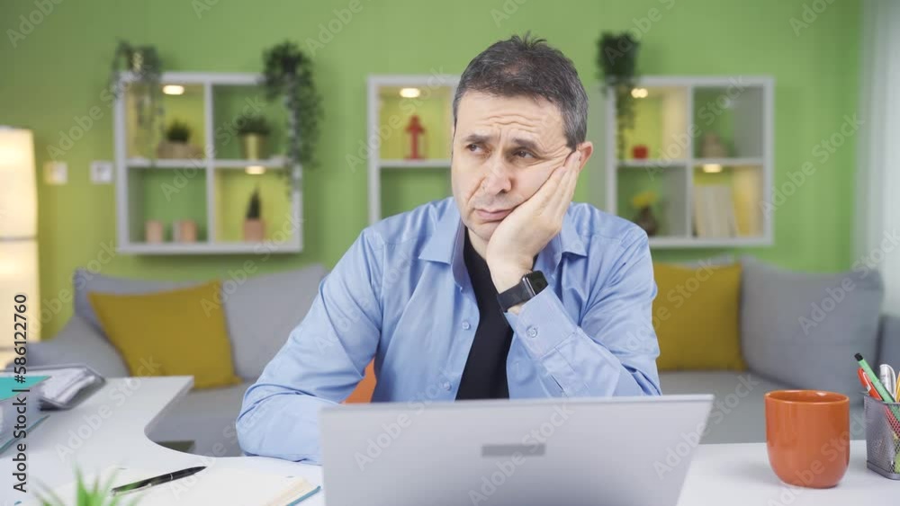Home office worker man thoughtful when things are not going as he wanted.
Unhappy man contemplating in front of laptop at his desk at home. Expression of negativity in their work.
Home office worker man thoughtful when things are not going as he wanted.
Unhappy man contemplating in front of laptop at his desk at home. Expression of negativity in their work.