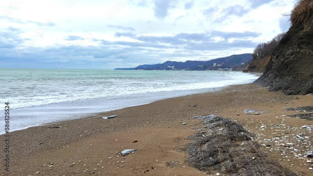 Powerful sea waves are crashing on the Black Sea coast. Waves splash on the beach with pebbles during a storm. Storm at sea. Panoramic view of the Black Sea. Russia. Sunset on the beach. 4K Powerful sea waves are crashing on the Black Sea coast. Waves splash on the beach with pebbles during a storm. Storm at sea. Panoramic view of the Black Sea. Russia. Sunset on the beach. 4K