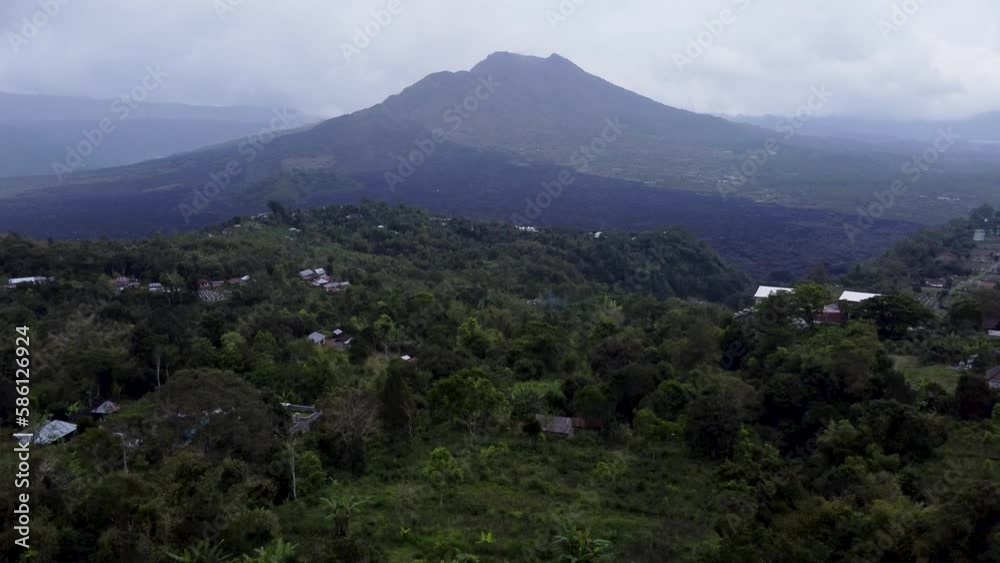 Aerial DRONE view of Mount Batur Volcano in a rainy day in Kintamani, bali indonesia