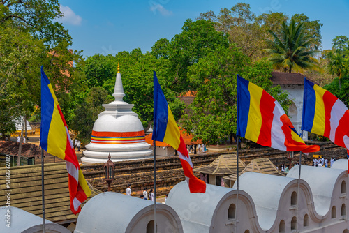 Religious complex in front of the Temple of the sacred tooth relic in Kandy, Sri Lanka photo