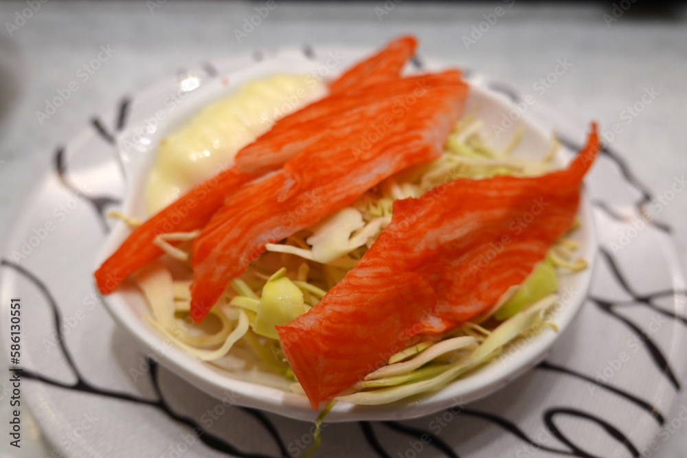 Crab sticks salad with shredded cabbage and mayonnaise. Crab sticks salad with shredded cabbage and mayonnaise.