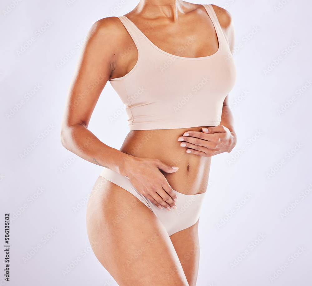 Body, underwear and stomach of a woman or natural model with smooth skin isolated in a studio white background. Weight loss, diet and female touch belly for healthcare, fitness and nutrition