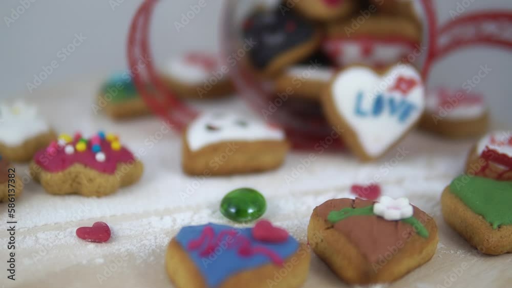 Homemade romantic cookies in the shape of hearts with icing and sprinkles on white background. Valentine's day gift Homemade romantic cookies in the shape of hearts with icing and sprinkles on white background. Valentine's day gift