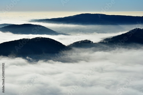 View of the Czech Central Highlands during the inversion. Hills emerging from the mist. Czech Republic, Europe.  photo