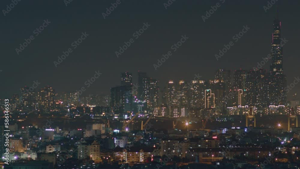 Time lapse aerial shot of downtown in the city during night time, panoramic view of cityscape and business district Time lapse aerial shot of downtown in the city during night time, panoramic view of cityscape and business district