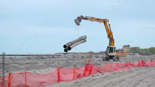 Transport of beach dredging and nourishment pipes photo
