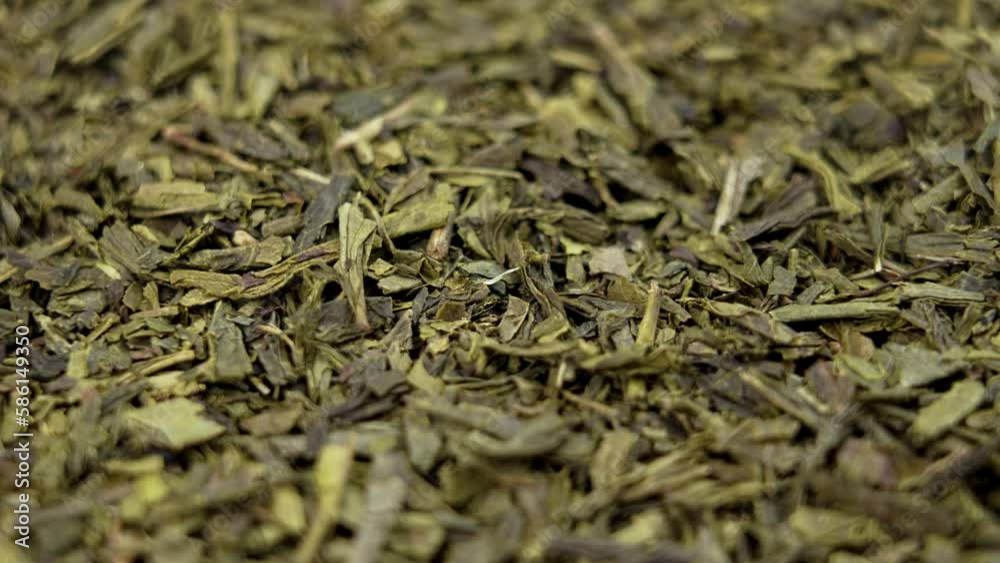 Dry Chinese green sencha tea leaves close up. Rotation Dry Chinese green sencha tea leaves close up. Rotation