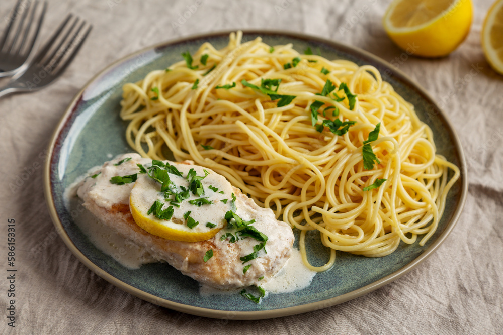 Homemade Creamy Lemon Chicken in a Pan, side view. Homemade Creamy Lemon Chicken in a Pan, side view.