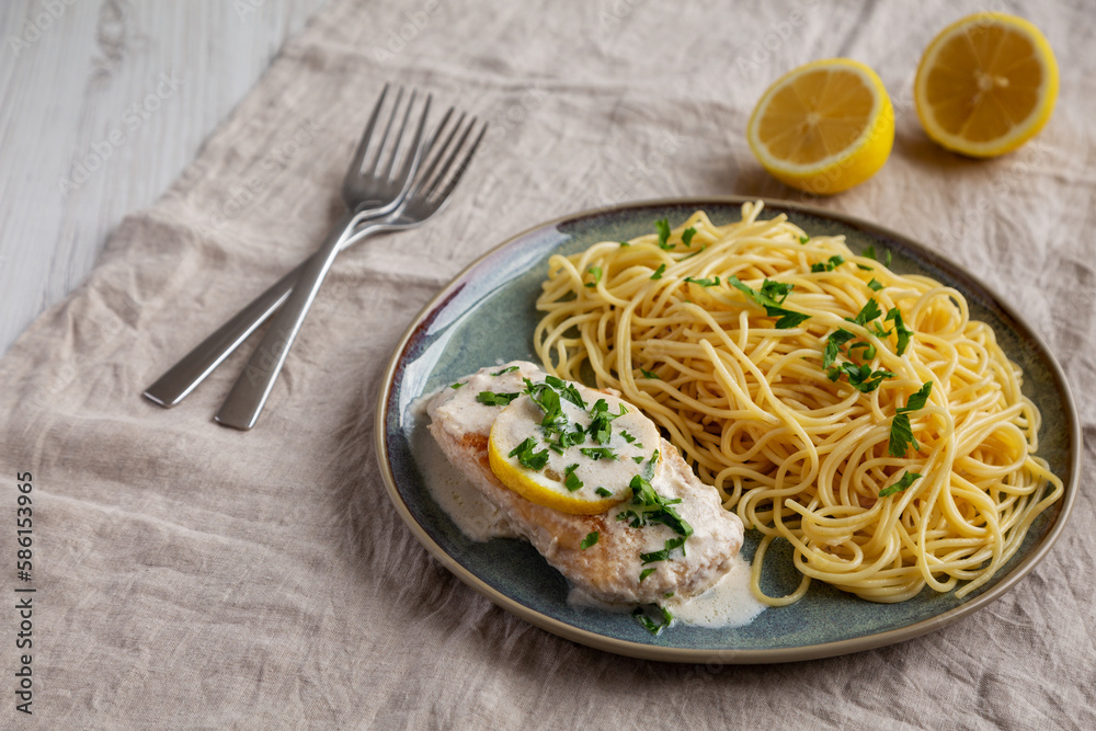 Homemade Creamy Lemon Chicken in a Pan, side view. Homemade Creamy Lemon Chicken in a Pan, side view.
