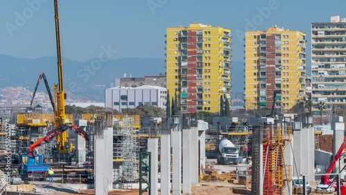 Public works with housing buildings in the background.Time Lapse.
View of the construction of the infrastructure of the future La Sagrera train station in Barcelona.Smooth camera movement: Zoom out photo