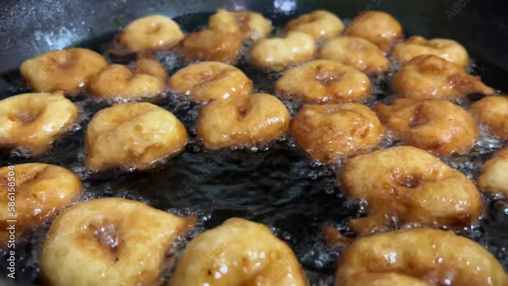 Homemaid preparation scene of “buñuelos de viento” (Spanish traditional dessert). Homemaid preparation scene of “buñuelos de viento” (Spanish traditional dessert).