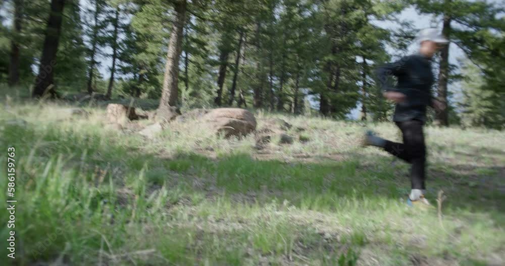 Man running through forest in summer Man running through forest in summer
