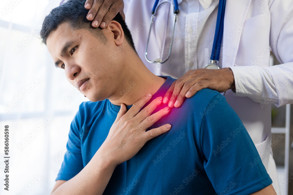Φωτογραφία Young Asian man doing physiotherapy and seeking advice from muscle pain with shoulder, limbs in rehabilitation center