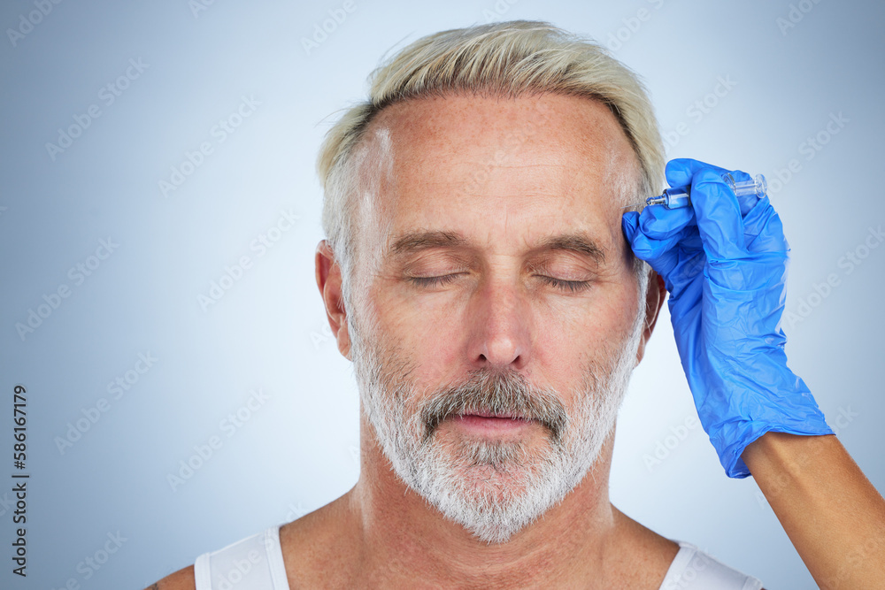 Fototapeta premium Needle, face and cosmetic of a senior man in a studio doing plastic surgery and cosmetic skincare. Dermatology, wrinkles and anti aging treatment of a mature model with silicone filler injection