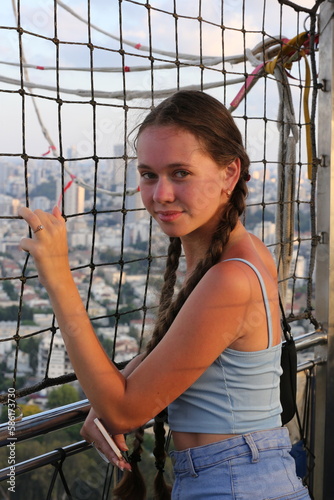 A girl looks into the distance in a hot air balloon in Hayarkon Park in Tel Aviv, Israel photo