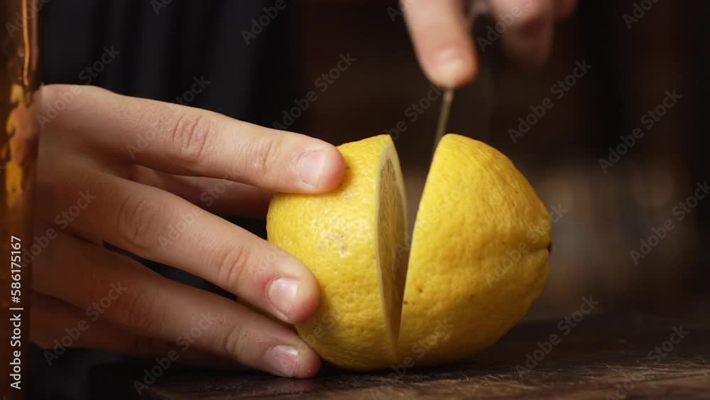 Cutting lemon in the restaurants cocktail bar