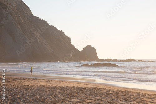 Obraz na płótnie Figure with Sea, Cliffs and Rocks With Mist at Odeceixe Beach; Algarve; Portugal w salonie