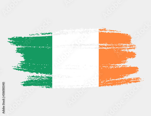 Artistic grunge brush flag of Ireland isolated on white background. Elegant texture of national country flag photo