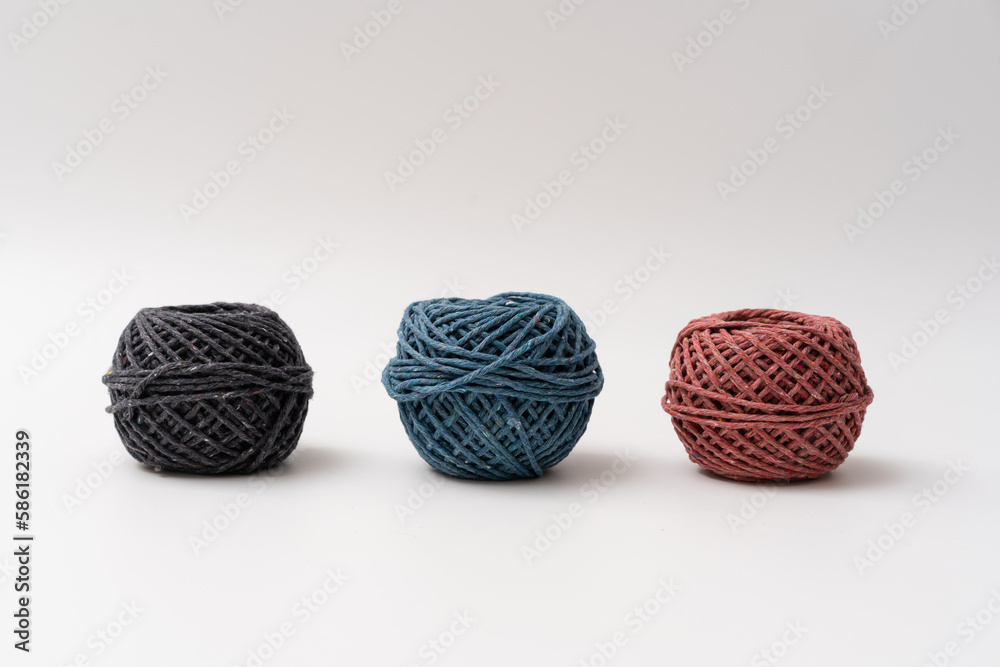 Various roll of earth colour string on isolated white background Various roll of earth colour string on isolated white background