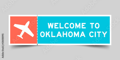 Orange and blue color ticket with plane icon and word welcome to oklahoma city on gray background