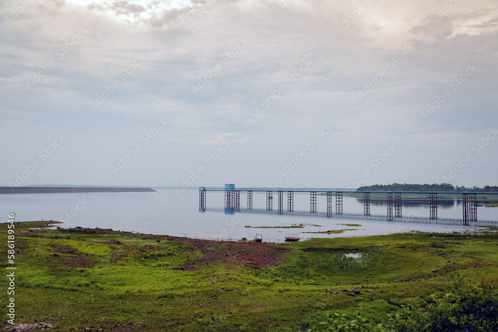 Dam in Mukutmanipur, West Bengal with a beautiful landscape in the background. Cloudy day.