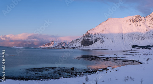 Fantastic colorful sunset on Skagsanden beach. Amazing Norway natural seascape. popular touristic attraction. Lofoten islands is a Best famouse travel locations. Scenic Image of nature landscape. photo